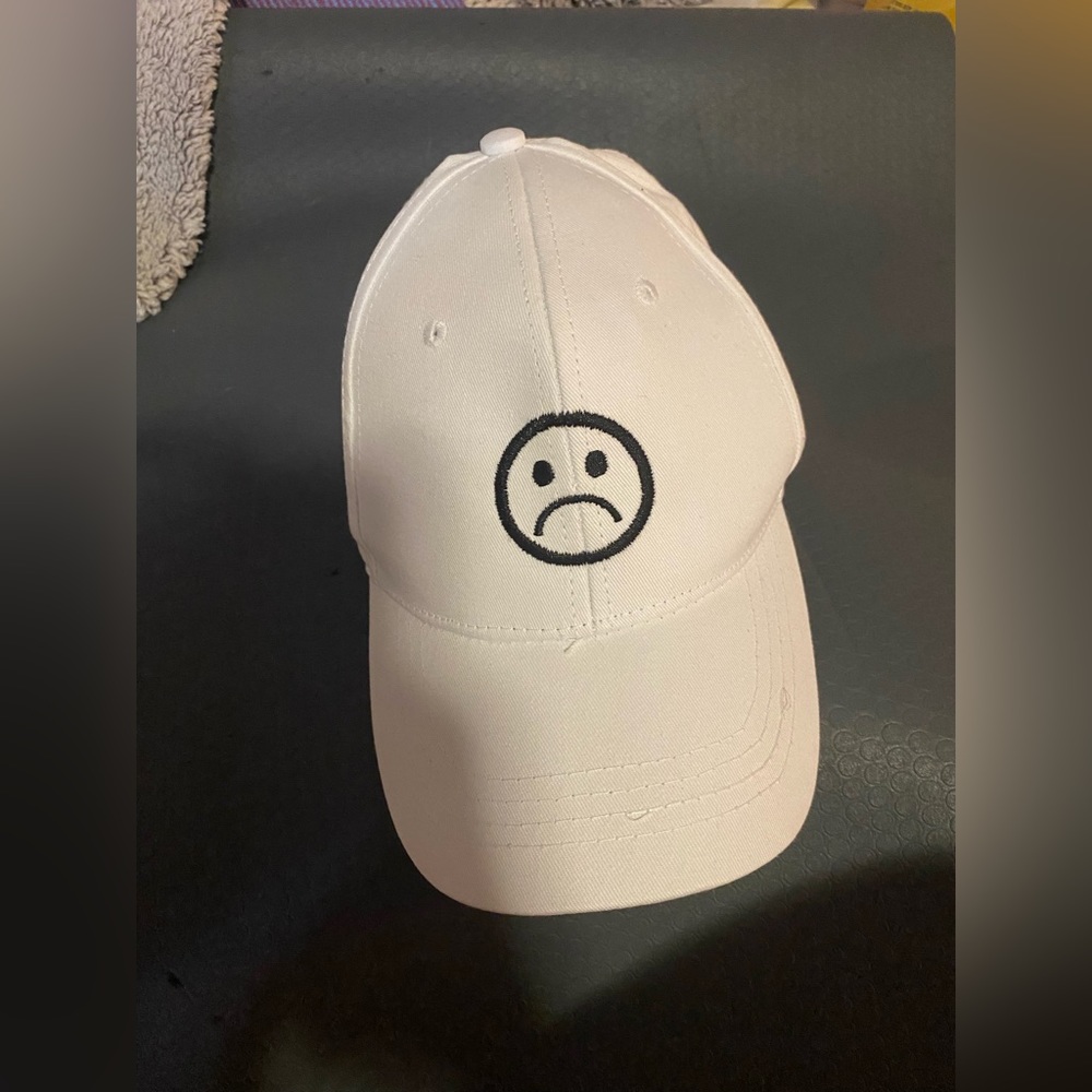 white sad face hat